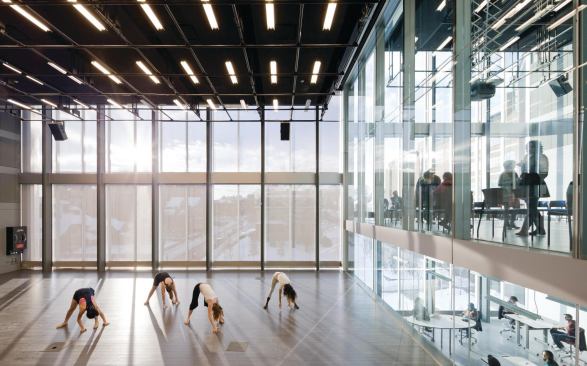 The north and south wings are visually connected through the glass shear wall that separates them: Production 1 looks up into Production 2, and down into the multimedia room on the floor below.