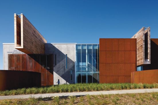 The new civil engineering building at the University of Minnesota Duluth—designed by Chicago-based Ross Barney Architects—uses locally sourced materials such as concrete and Cor-Ten steel. The protruding water scuppers are clad in wood reclaimed from old pickle barrels.