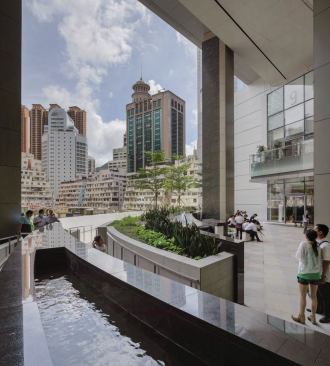 A sky garden located off of the retail podium. Glass doors, by Dorma and Kaba, grant access to the gardens.