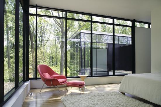 Simple architecture is echoed by a simple palette of stucco, fiber cement, and ebony and zebra woods.

