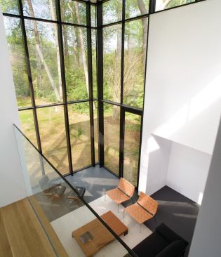 David Jameson uses storefronts as instruments of light, but he also uses windows as "lenses to the landscape" that edit views of passing vehicles.  

