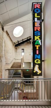 Remnants of the building's former lives grace its refashioned circulation spaces.