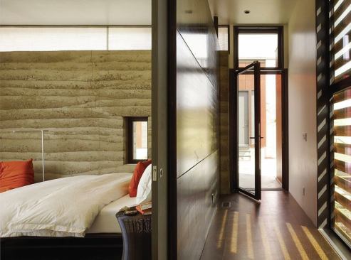 The secondary bedroom’s rammed earth wall served as a trial run for the great room’s longer version.
