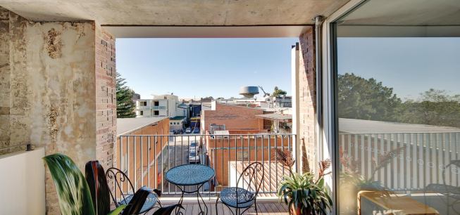 Saw cuts expose the building's 18-inch-thick walls.