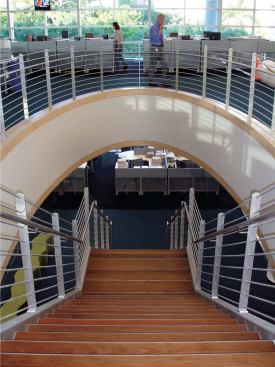 The bulk of the newspaper's employees work in the second and third floor newsrooms, connected by a large open stairwell to promote ready circulation between departments. The third floor ceiling is shaped by the folds of the roof, lending a sense of sculpture to the sea of cubicles.


Interior paint - Porter Paints - www.porterpaints.com 

Available primarily as tinting bases to allow for exact color matching and custom color - Eggshell, matte, and various gloss options available - Coverage is approximately 400 square feet per gallon on smooth surfaces - Low odor - Soap and water clean-up


Tru Colours modular carpet tile - Shaw Contract - www.shawcontractgroup.com 

Solution-dyed nylon carpet fibers - Ecoworx backing - Level-loop construction


Concore-panel raised access floor - Tate Access Floors - www.tateaccessfloors.com 

Panels have a flat-top steel sheet welded to a formed-steel bottom sheet - Filled with lightweight cement

available in 24-inch squares


Ripple bench - Steelcase - www.steelcase.com 

Available with flat or wave tops - Optional ganging device to connect individual benches together - Designed by Laurinda Spear of Arquitectonica 