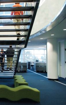 The bulk of the newspaper's employees work in the second and third floor newsrooms, connected by a large open stairwell to promote ready circulation between departments. The third floor ceiling is shaped by the folds of the roof, lending a sense of sculpture to the sea of cubicles.


Fineline ceiling suspension system - USG - www.usg.com 

Narrow slotted profile - 1/4-inch reveal - Mitered intersections - Hotdipped galvanized steel construction - Optional air diffuser


Millenia ceiling tiles - USG - www.usg.com 

Fine-textured acoustical panels - Inhibition of mold/mildew - High noise-reduction coefficients - Alternative to face-laminated panels