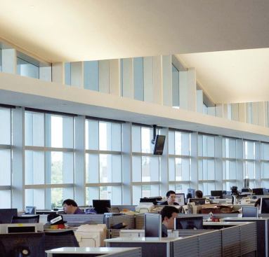 The bulk of the newspaper's employees work in the second and third floor newsrooms, connected by a large open stairwell to promote ready circulation between departments. The third floor ceiling is shaped by the folds of the roof, lending a sense of sculpture to the sea of cubicles.


Indirect fluorescent cove lights - Insight Lighting - www.insightlighting.com 

Single-piece extruded aluminum luminaire housing - Takes T5 or T5HO lamps - Standard low-profile bracket allows cove-mounting - Rotatable fixture allows for wash to be directed and adjusted


Diet panel system - Teknion - www.teknion.com 

Thin 1.3-inch-thick freestanding panel system - Designed for highdensity applications - Walls can be specified with combinations of fabric, glazed, open, and slat panels