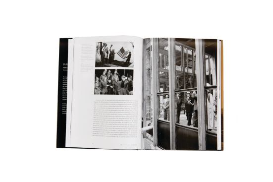 A spread from Building Seagram. In the photo on the right page, Mies and other building committee members visit the site in July 1956 as it was under construction.