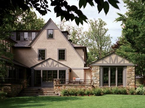 Muse spends a lot of time undoing what others have done over the years. He removed a series of appendages on the back of this Tudor home and added two smaller gabled additions that allow its strong forms and sweeping roofline to read.