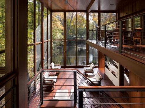 Moore returned to his first commission, Winding Lane, to add a Bali-inspired three-tier screened porch in 2006. Done in mahogany with a Sikkens boat finish, each deck level orients to a different view of the surrounding wetlands. As furnished rooms, the c