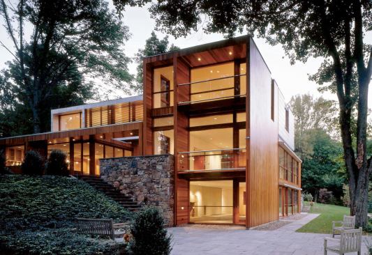 Moore's award-winning reinvention of an early 1950s Eliot Noyes house included restoring the original first-floor shell and adding a floating second-story box that mimics the proportions of Noyes - creation, based on a nine-square grid. In contrast to dev