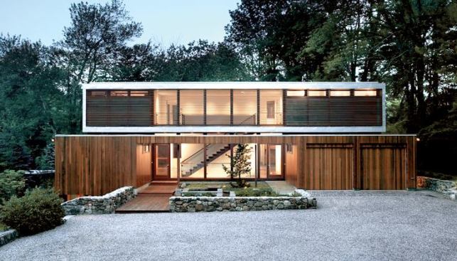 Moore's award-winning reinvention of an early 1950s Eliot Noyes house included restoring the original first-floor shell and adding a floating second-story box that mimics the proportions of Noyes - creation, based on a nine-square grid. In contrast to dev