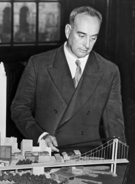 Robert Moses with a model of the proposed Brooklyn-Battery Bridge, 1939.