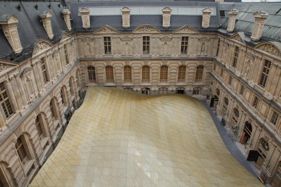 Visitors who look out into the Cour Visconti on the Seine side of the palace see the pavilion’s roof below, a Saharan topography of gold-tinted mesh dunes. 