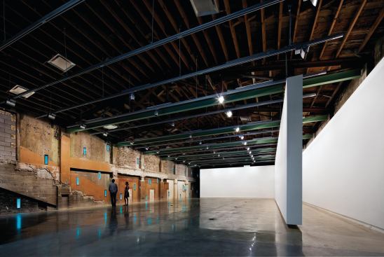 The second-floor gallery space with the suspended wall in a different location.