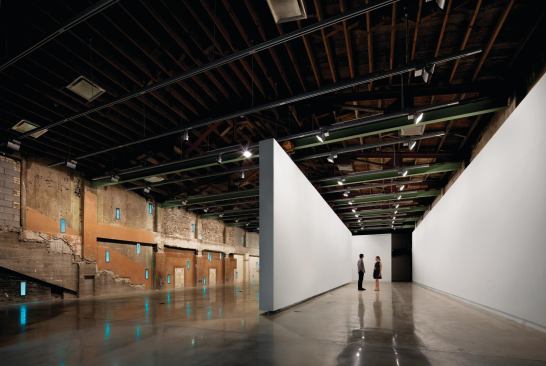 The second-floor gallery space with the suspended wall in a different location.