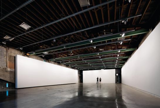 The second-floor gallery space with the suspended wall in a different location.