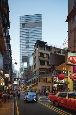 Punctuated by voids that promote airflow through the building mass, the tower, clad in glazing from China Southern Glass, holds a multistory retail center topped with offices.