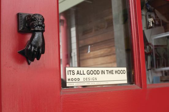 Detail from the signature red doors that first attracted Hood to the studio.