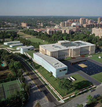 The crystal-like boxes of Holl's addition scatter down the museum's sloping lawn.