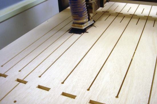 Using a CAD/CAM process with a CNC router, Dorsy saves every inch of standard 4x8 plywood sheets, leaving nothing behind but sawdust on the shop floor. 