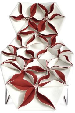 Antibodi

Moroso

www.moroso.it

Stainless steel frame covered by lightly padded petals of fabric

Reversible fabric combinations include leather and felt backed by wool fabric 

Cover can be applied with petals facing up or down

Designed by Patricia Urquiola