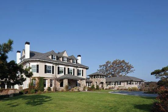 Replacement windows have diamond-patterned muntins common to the era. They added trim and crowns around the windows and hung real shutters. They replaced the roof and redid the siding with cedar shingles.