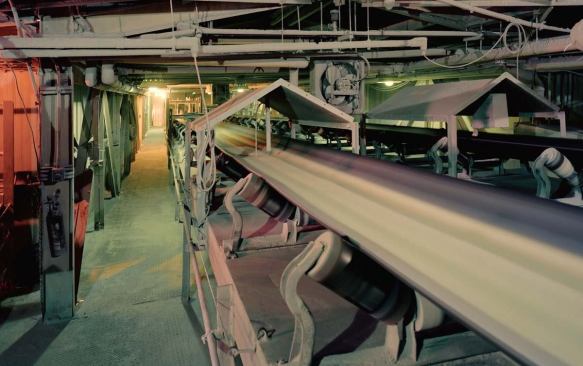 Batching begins when raw materials are combined on a conveyor belt to be weighed, blended, and carried to storage silos.