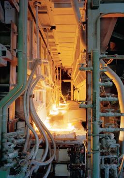 A hopper feeds the mixed materials into the front end of the 36-foot-wide melting furnace, where temperatures reach 3,000 F. 