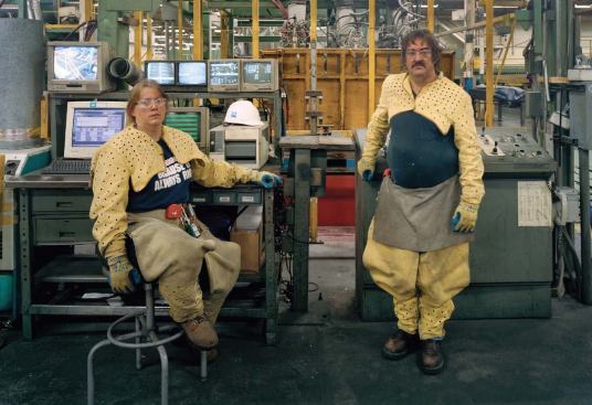 Because of the terrific heat of the glassmaking process, operators on the forming line work largely on computers in airconditioned consoles, yet wear protective clothing in case they need to approach the machinery. Even packing-line operators wear protective gear to shield them from broken glass.