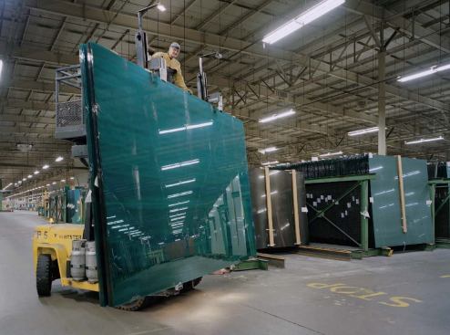 The finished product: Workers in the wareroom transport bulk loads of Azuria aqua-blue glass (made at PPG's Wichita Falls plant, though not in Carlisle). Each load weighs about 16,000 pounds.