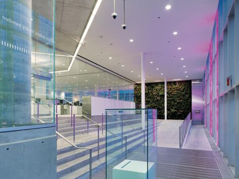 A green wall filters air before it returns into the HVAC system.