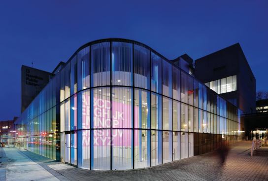 A secondary entrance on the northwest corner is marked by a projection wall where large-scale artwork can be displayed.