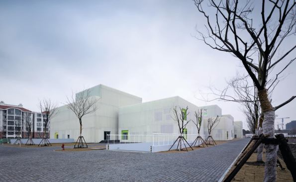 Many of the building volumes are clad in perforated metal screens attached to brightly colored concrete walls. Cutouts in the screens reveal insulating low-E glazing from Zhuogao Glass.