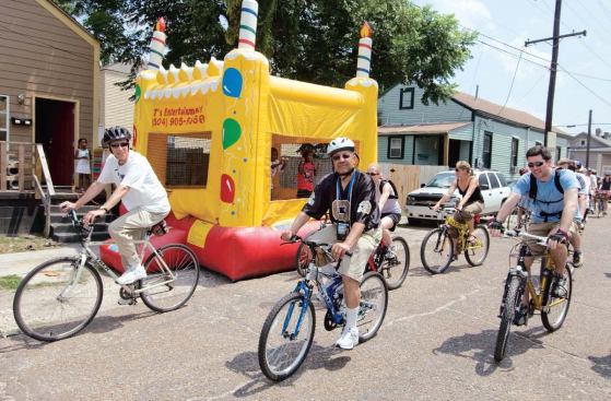 Wearing a New Orleans Saints jersey, Ed Blakely leads a public bike ride through the Riverbend and Carrollton neighborhoods, June 3, 2007.