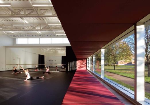 Activity in the dance studio invites the gaze of passing pedestrians.