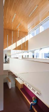 The light-wood ceiling in the double-height lobby of the Colman Theater nods to the original wood-strip lobby ceiling designed by Green.