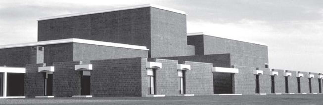 A side view, revealing the tallest volume_the flyloft-shared by the theaters to either side.