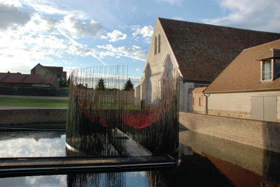 At the Maladrerie Saint-Lazare, a 12th-century hospital for the treatment of leprosy in Beauvais, in northern France, Cao | Perrot designed Red Bowl, a temporary installation that hints at the suffering of former inhabitants. The balls of red glass allude to a medieval belief that lepers could be cured by bathing in blood, Perrot says. Visitors walk over a pond on burnt-wood ramps through a bowl formed of steel rods. “When the sun hits, you will see these little drops of blood,” Perrot says. “Also, the movement: It’s a windy site, and the whole installation will move, like wheat.”