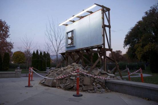 Made from salvaged building debris and paper, After (Billboard) makes commentary on the empty content of condominium advertising.