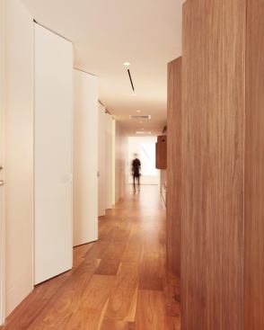 Full-height sliding and accordion doors hide ample storage throughout the space.