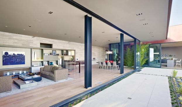 Direct and uncomplicated, the glass living pavilion transforms into a porch when the doors are open.
