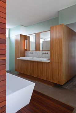 2012 Bath/Merit: 
Appleton Living, Venice, Calif., by Minarc, Santa Monica, Calif.   A walnut millwork “box” separates the bath from the master bedroom.