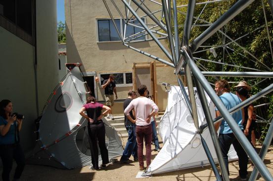 Busby’s full-sized tents fill the courtyard alongside Borden’s jungle gymlike installation, Light Frames.