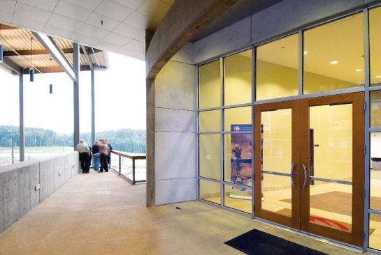 Views inside the two-story, 40,000-square-foot River Center: an overlook jutting from the upper (entry) level.