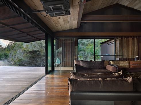 When stowed, the shutter panels nest beneath the roof’s generous soffit.