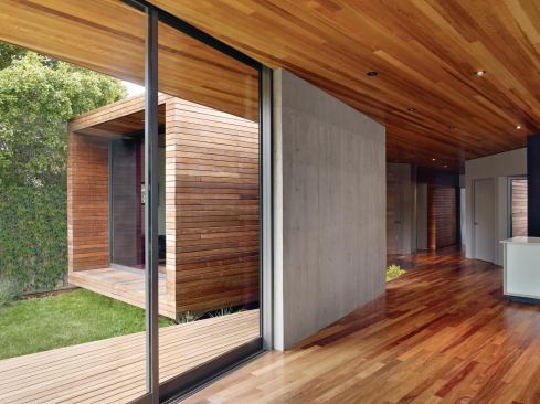 The larger volume contains a kitchen, dining, and media room, while the smaller one (background of photo) holds a master bedroom wing.