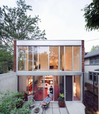 The rear of the house opens into an enclosed garden that essentially doubles the living space of the first floor.