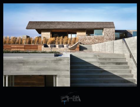 Sawn stone walls bring an appropriately raw sensibility to the seaside house.