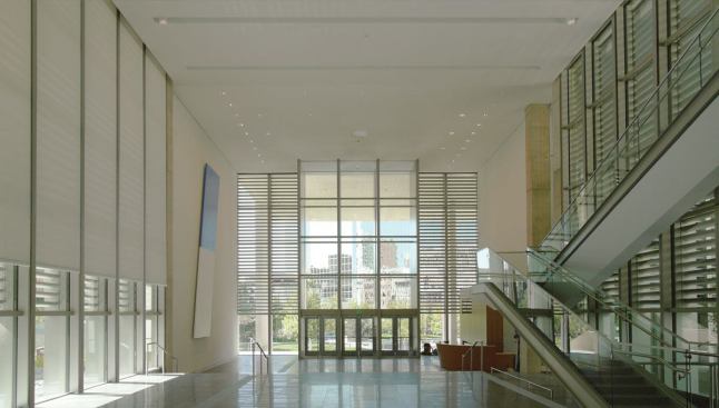 DETAILS, DETAILS

The museum lobby, floored in dark gray basaltina, frames a view across the park, with downtown Grand Rapids in the background.